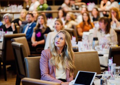 Woman listening to a speech at The Common Ground of Energy Transformation event