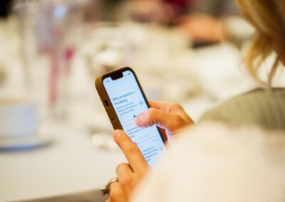 Person on their phone using a slider to state their agreement to a question