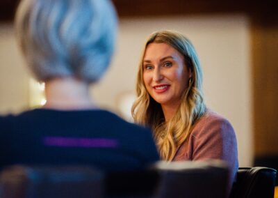 Presenter listening to a speech during The Common Ground of Energy Transformation event