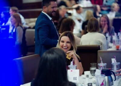 Woman laughing during a conversation at The Common Ground of Energy Transformation event