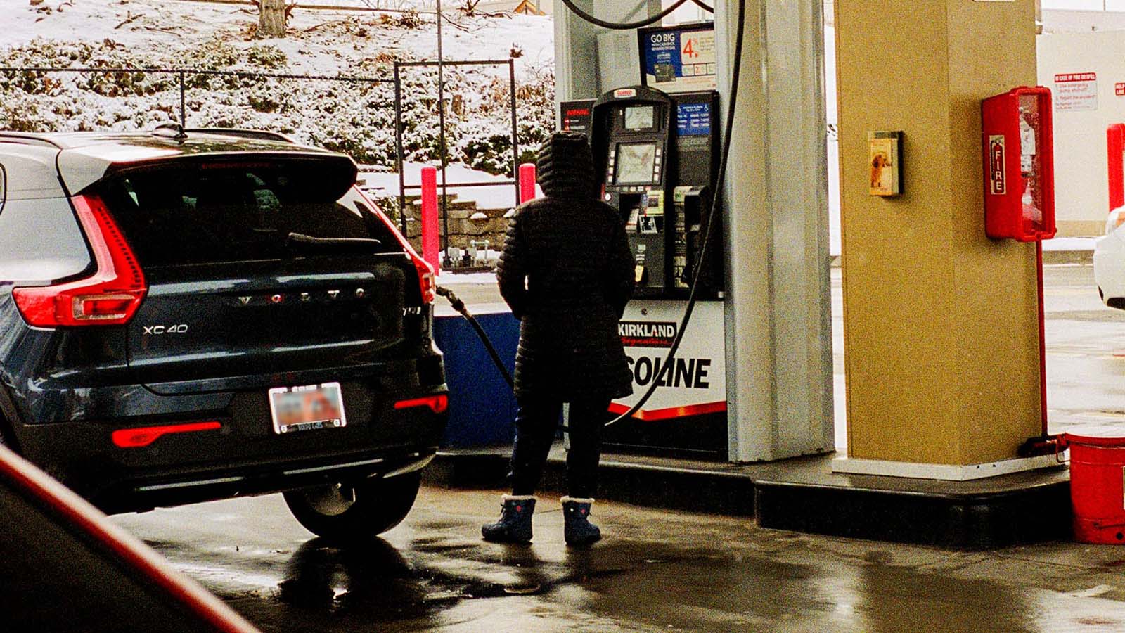 Woman Filling up Tank at Costco gas station